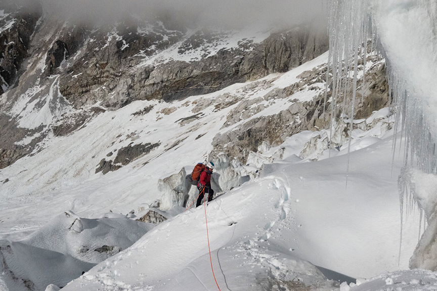 A climber on a mixed terrain.